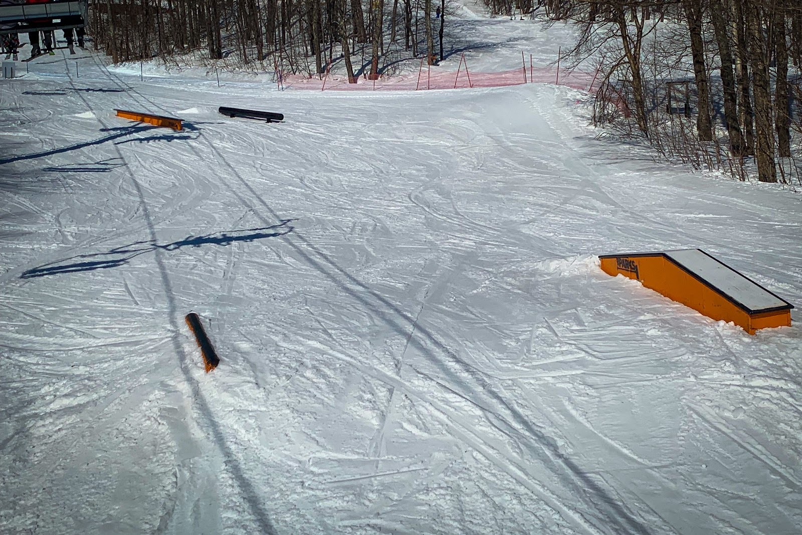 Terrain park features including a flat rail, mailbox and up-down box